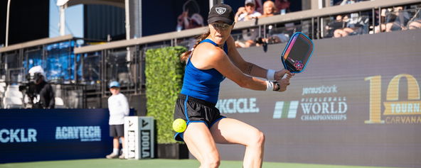Kaitlyn Christian preparing to hit a return.