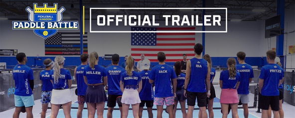 Sixteen players standing in front of a flag.