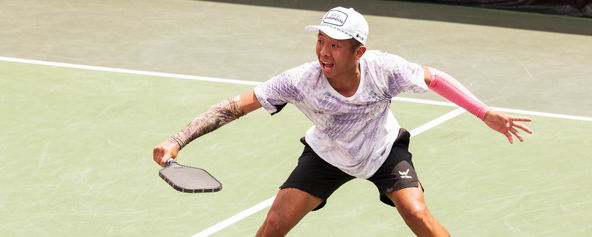 Quang Duong hitting a return.