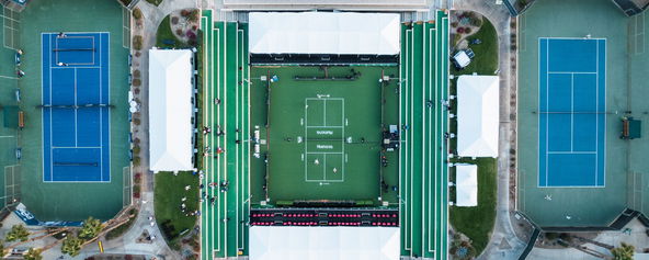 Two tennis courts next to a pickleball court.