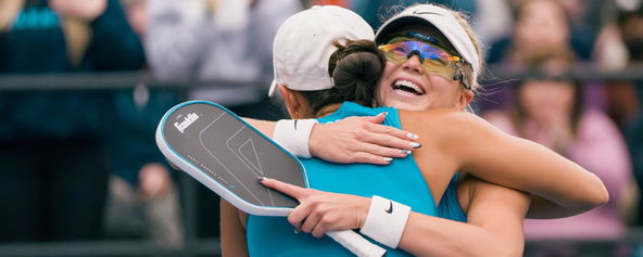 Anna Leigh Waters hugging Anna Bright following a match.