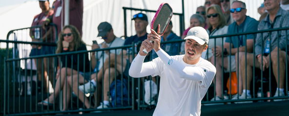 Ben Johns hitting a pickleball backhand.