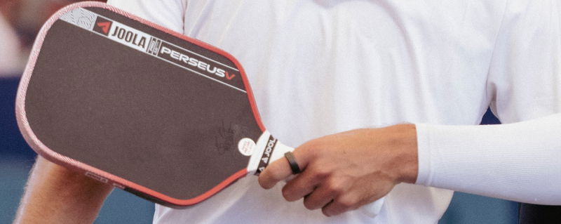 A close-up of a JOOLA paddle.