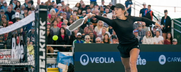 Lacy Schneemann hitting a pickleball forehand.