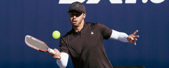 Ben Johns preparing to hit a pickleball.