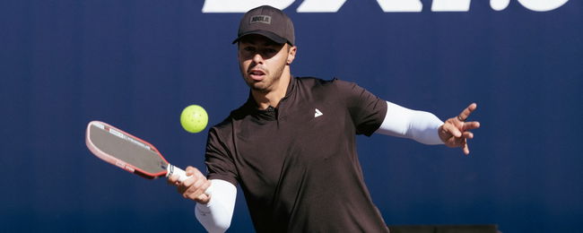 Ben Johns preparing to hit a pickleball.