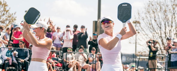Anna Bright and Anna Leigh Waters celebrating their women's doubles title.
