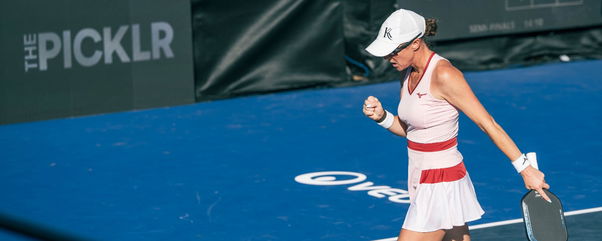 Christian wearing a pink dress and playing pro pickleball