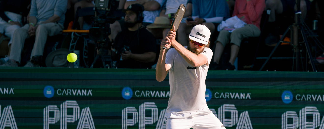 Will Howells hitting a pickleball backhand.