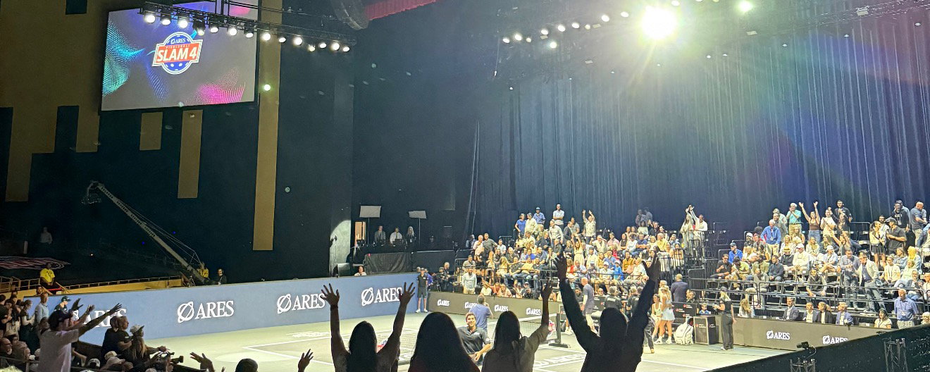 Fans standing up and cheering watching the Pickleball Slam 4