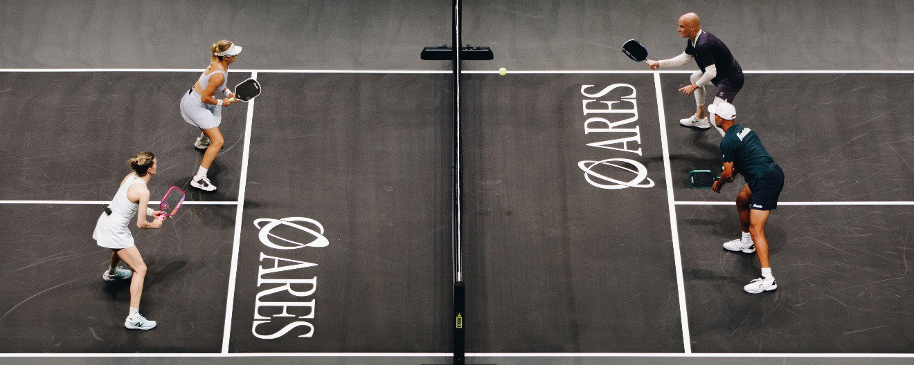 Anna Leigh Waters and Genie Bouchard facing Andre Agassi and James Blake.