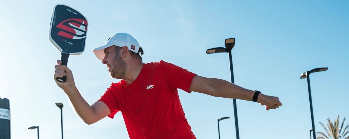 A man playing pickleball.