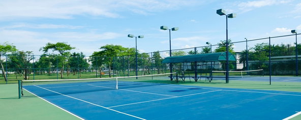 A tennis court at a park.
