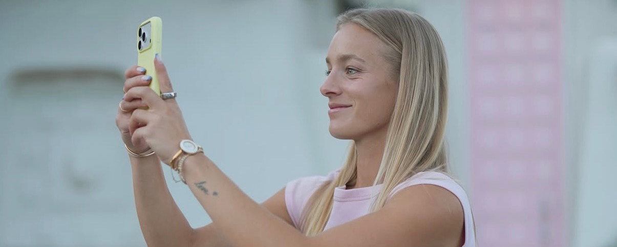 Hannah Blatt taking a photo with her phone.