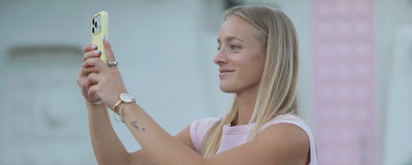 Hannah Blatt taking a photo with her phone.