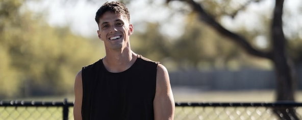 Connor Derrickson smiling on a pickleball court.