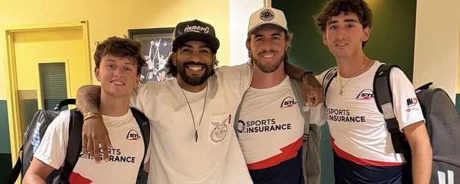 Charles Johnson with his arms around Hayden and Hunter, smiling.