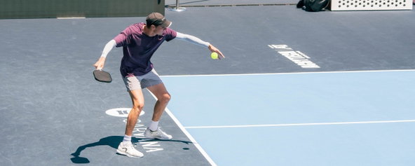 Roscoe Bellamy serving during a PPA tournament.
