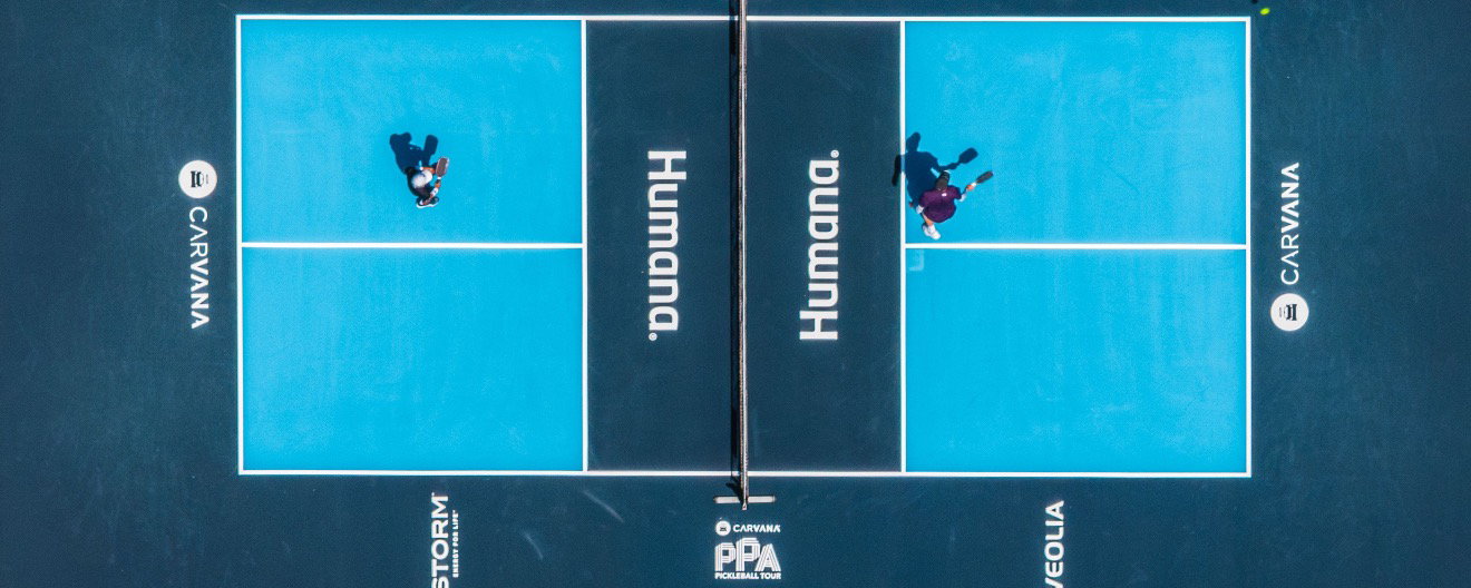 Overhead image of two people playing pickleball on the PPA Tour.