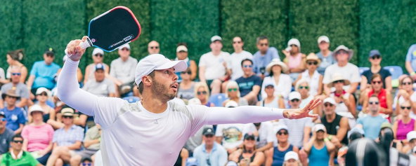 Ben Johns playing a pro pickleball match using a JOOLA paddle.
