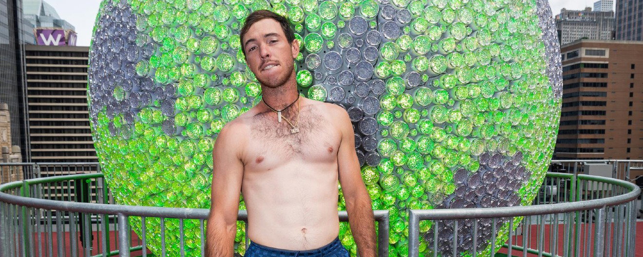 JW Johnson with his shirt off and biting his lip.