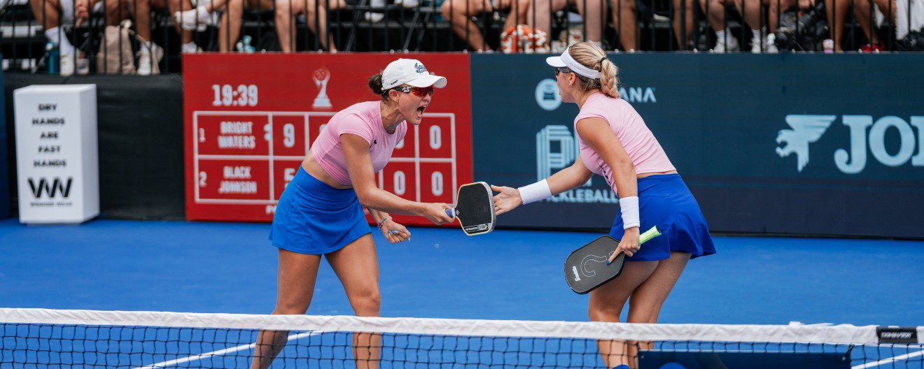 Anna Bright and Anna Leigh Waters celebrating a point during the women's doubles final at the Veolia Pickleball National Championships in Cary, NC.