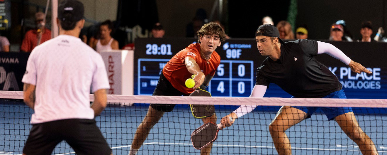 Gabe Tardio playing the right side in pickleball with Ben Johns on the left.