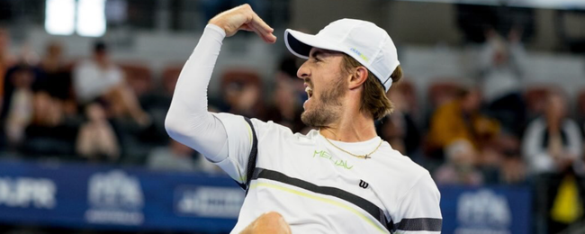 Hunter Johnson celebrates his men's singles victory on Championship Sunday.