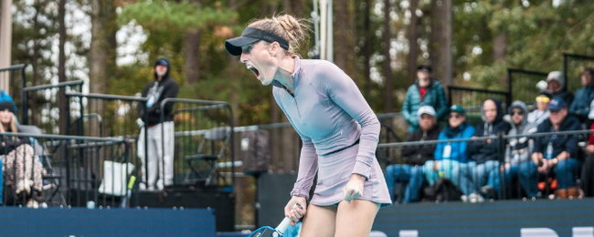 Helena Jansen wearing a light purple outfit, cheering on the pro pickleball court.